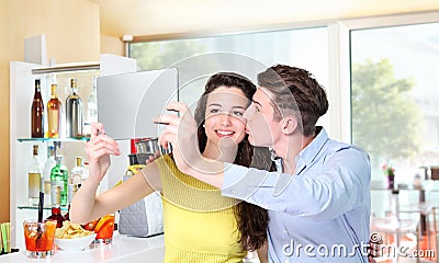 Smiling couple make a selfie in coffee bar Stock Photo