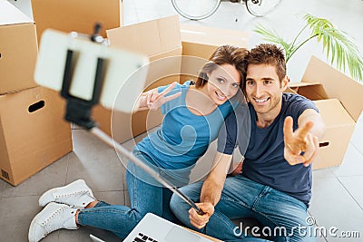 Smiling couple taking selfies Stock Photo