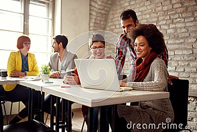 Smiling coworkers working together on a project Stock Photo