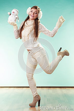 Smiling cute woman with little snowman. Winter. Stock Photo