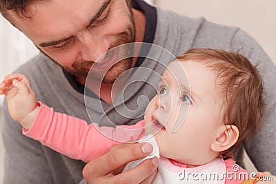 Smiling daddy sitting with baby Stock Photo