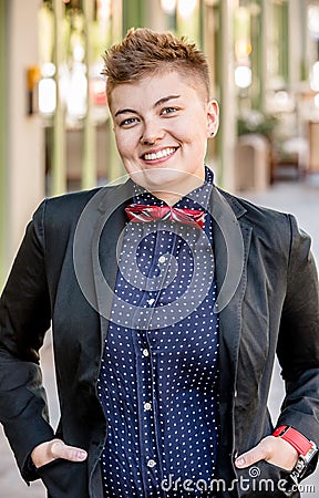 Smiling Dapper Gender Fluid Young Woman Stock Photo