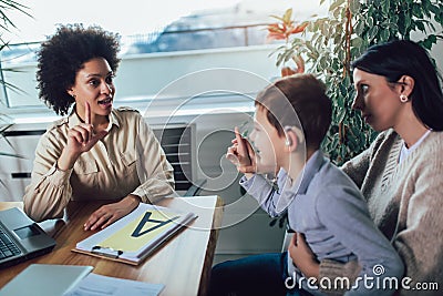 Deaf boy learning sign language. Selective focus Stock Photo