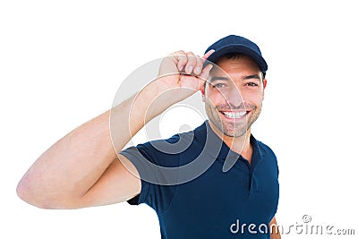 Smiling delivery man wearing cap on white background Stock Photo