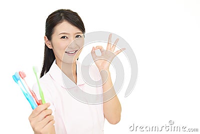 Smiling dental hygienist Stock Photo