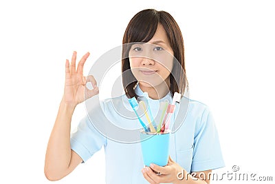 Smiling dental hygienist Stock Photo