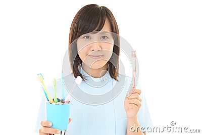 Smiling dental hygienist Stock Photo