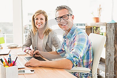 Smiling design team working with digitizer Stock Photo