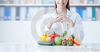 Smiling dietician with healthy vegetables Stock Photo