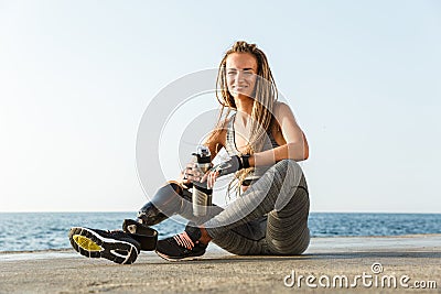 Smiling disabled athlete woman with prosthetic leg Stock Photo