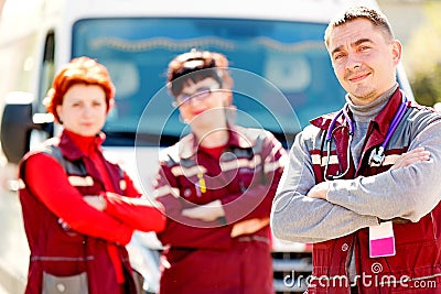 Smiling doctor man with paramedics coworker Stock Photo