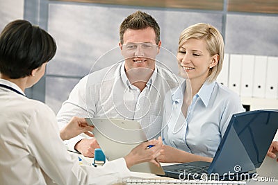 Smiling doctor with patient Stock Photo