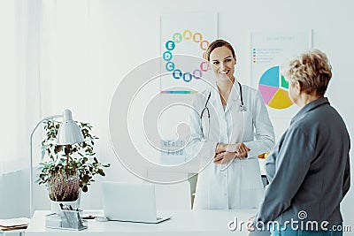 Doctor talking to a patient during a consultation Stock Photo