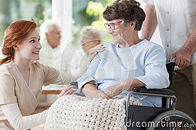 Smiling elder woman on wheelchair Stock Photo