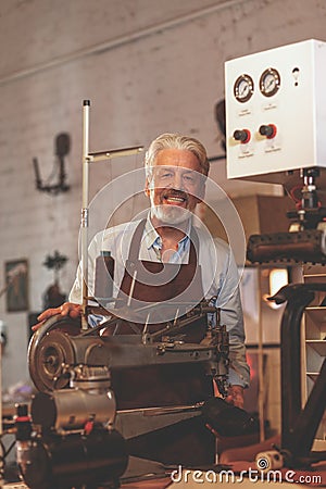 Smiling elderly man in uniform Stock Photo