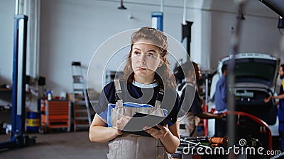 Smiling engineer checks car performance Stock Photo