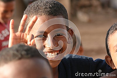 Smiling Eritrean boy makes the sign of ok in the suburbs of Asmara, Eritrea Editorial Stock Photo