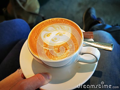 Face in cappuccino froth Stock Photo