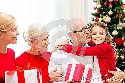 Smiling family with gifts at home Stock Photo