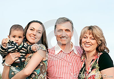 Smiling family and grandparents in the countryside Stock Photo