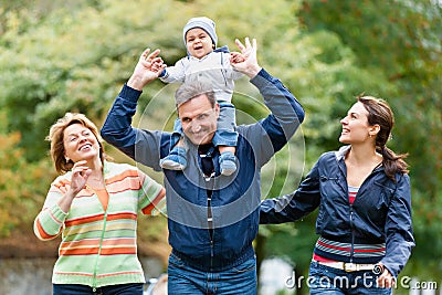 Smiling family and grandparents in the countryside Stock Photo