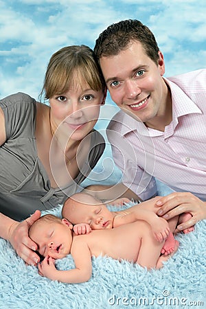 Smiling family with newborn twin babies Stock Photo
