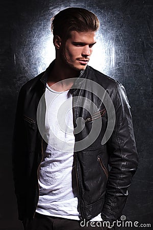 Smiling fashion man wearing a leather jacket Stock Photo