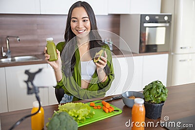 Smiling female blogger looking at the camera Stock Photo