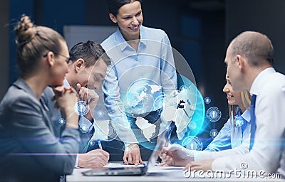 Smiling female boss talking to business team Stock Photo