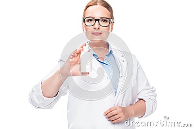 smiling female doctor in eyeglasses showing pill bottle Stock Photo