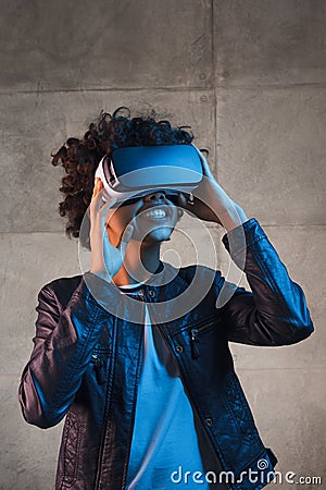 Smiling female enjoying VR goggles Stock Photo