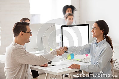 Smiling female worker congratulating job applicant with successf Stock Photo