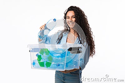 Female Putting Bottle To Box With Recycling Symbol, White Background Stock Photo