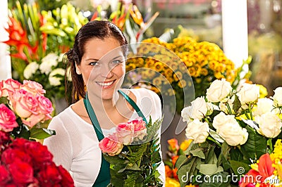 Smiling florist flower shop colorful making bouquet Stock Photo