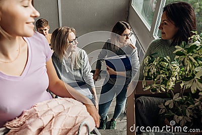 Smiling, foretaste, anticipating students carrying luggage on the stairs, talking while relocation. First year education Stock Photo