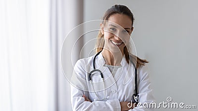 Smiling friendly young female professional confident doctor head shot. Stock Photo