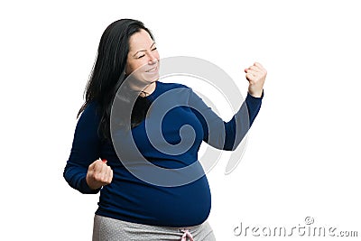 Smiling future mom making success gesture with hands Stock Photo