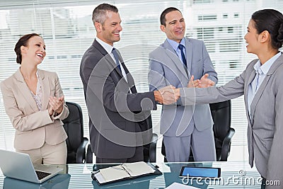 Smiling future workmates shaking hands Stock Photo