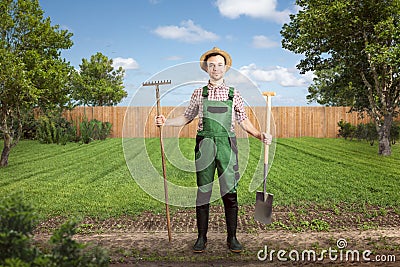 Smiling gardener ready for work in a green backyard Stock Photo