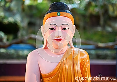 Smiling Gautama Buddha at Haw Par Villa, Singapore Stock Photo