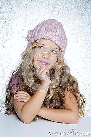 Smiling gesture little girl winter pink cap Stock Photo