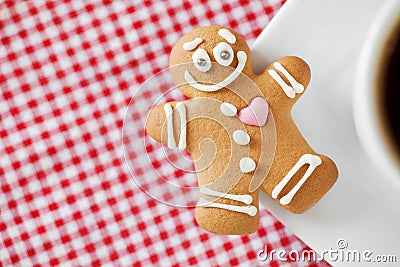Smiling gingerbread man and coffee cup Stock Photo