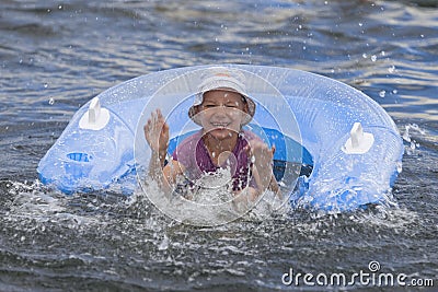 Smiling girl bathes in river Stock Photo