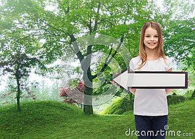 Smiling girl with blank arrow pointing left Stock Photo