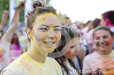Smiling girl enjoying The Color Run Bucharest. Happiest 5k on the planet! Editorial Stock Photo