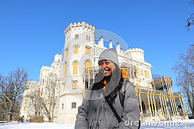 Smiling girl in front of palace Hluboka with terrace Stock Photo