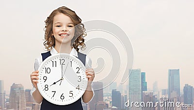 Smiling girl holding big clock Stock Photo