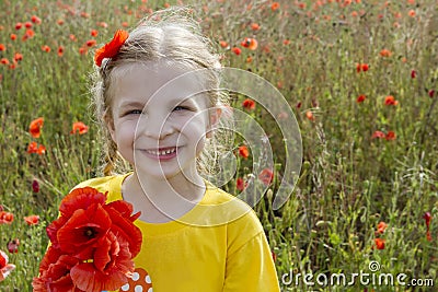 Smiling girl holding bouquet poppies Stock Photo