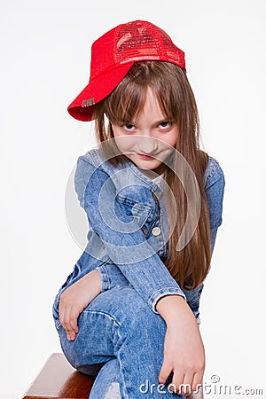 Smiling girl looking straight ahead from under her forehead Stock Photo