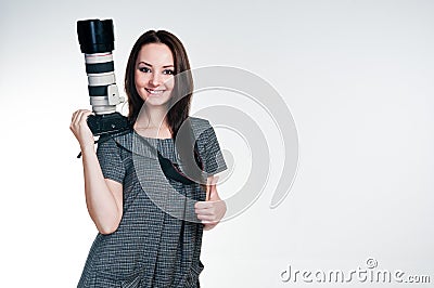 Smiling girl with professional camera Stock Photo